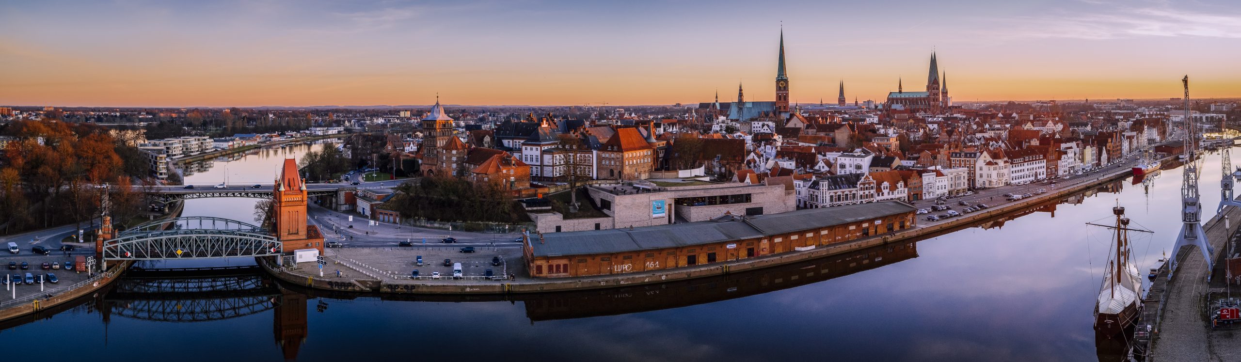 das immo büro Makler Lübeck – Lübeck Panorama im Sonnenuntergang